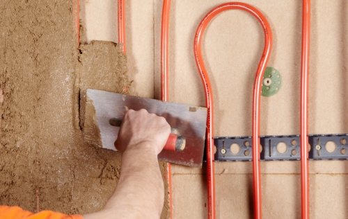 Möglicher Wandaufbau einer Innenwanddämmung aus Holzweichfaserplatten mit Wandheizung von WEM